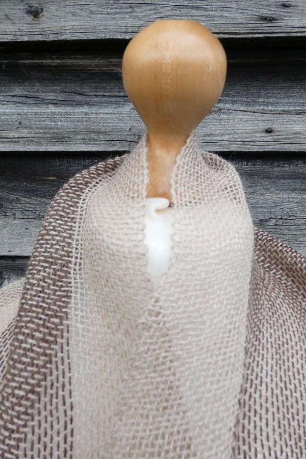 handwoven loose alpaca scarf in oatmeal neckline on dress dummy