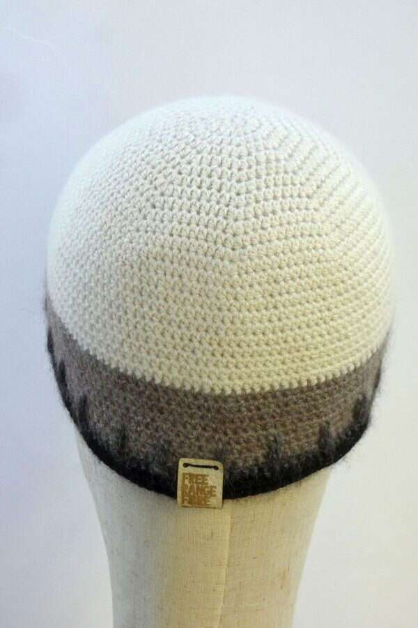 white beanie hat with grey and black stripe around circumference