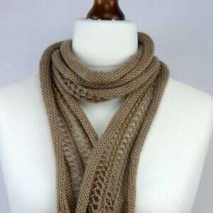 cappuccino colour narrow scarf with lace detail draped around the neck of a white tailors dummy