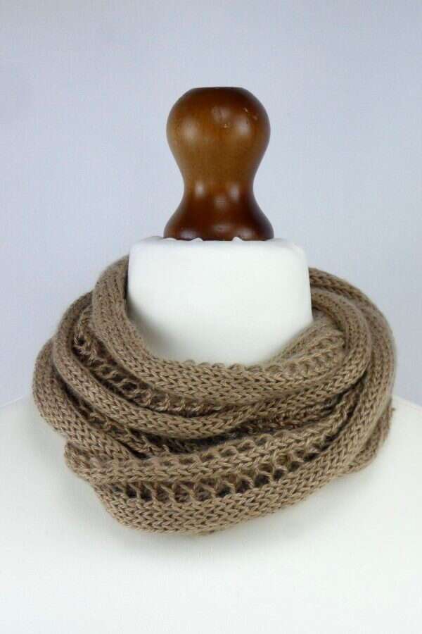 cappuccino colour cowl scarf around the neck of a white tailors dummy