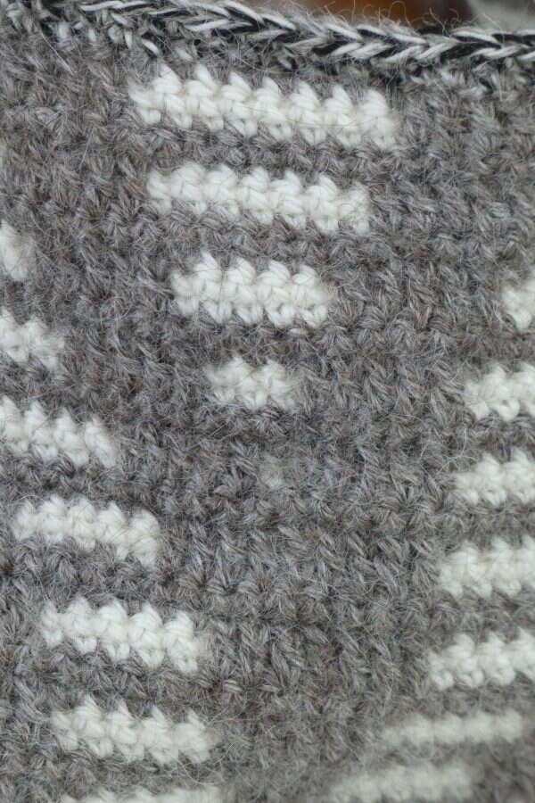grey cowl with white stripe detail close up
