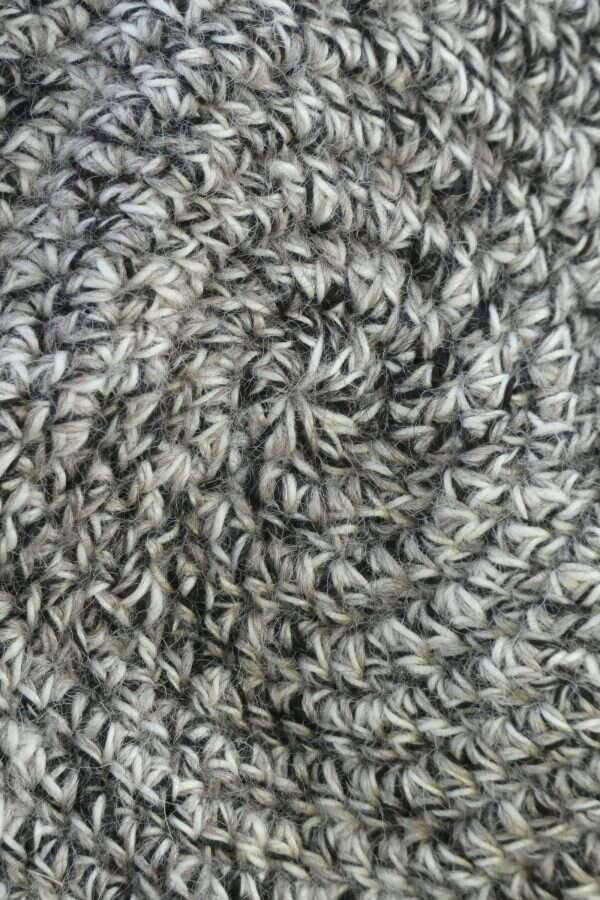close up view of crochet stitching in mottled black and white