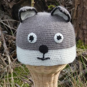 childs hat with a grey and white fox design made from alpaca yarn