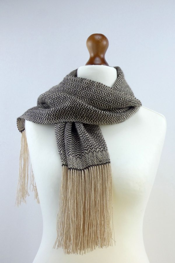 herringbone weave alpaca scarf wrapped around the neck of a tailors dummy