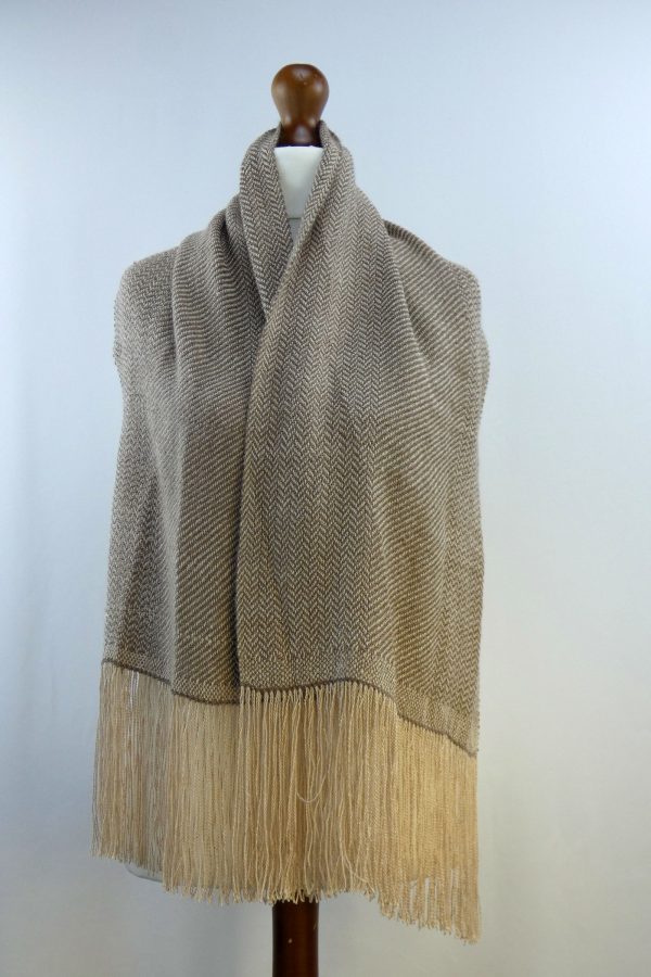 herringbone weave alpaca shawl draped over dress dummy
