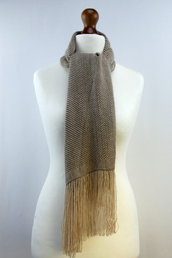 herringbone weave alpaca shawl tied around the neck of a tailors dummy