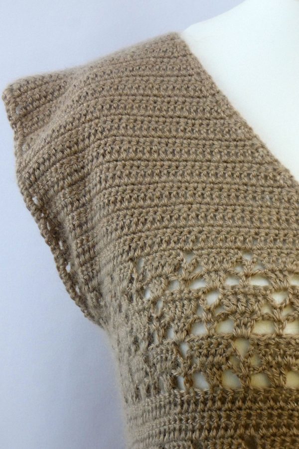 close up of the shoulder of a lacy crochet tank top made from fawn alpaca yarn