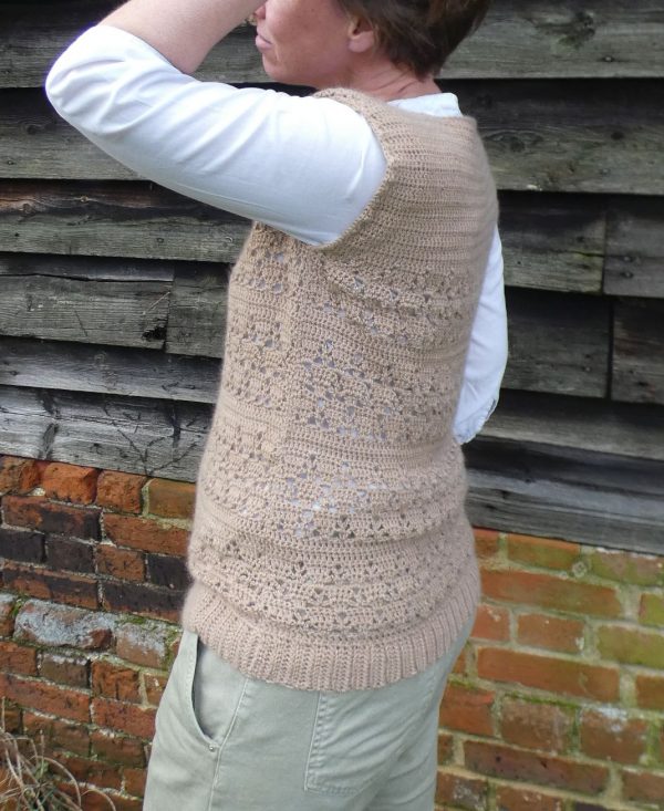 lady wearing a lacy crochet tank top made from a fawn coloured alpaca yarn