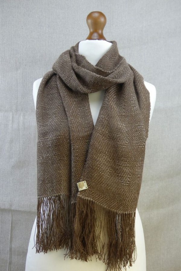 woven suri alpaca scarf with dot detail loosely wrapped on dress dummy