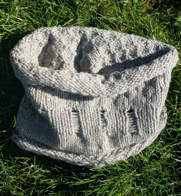 light grey shetland wool snood laying on grass