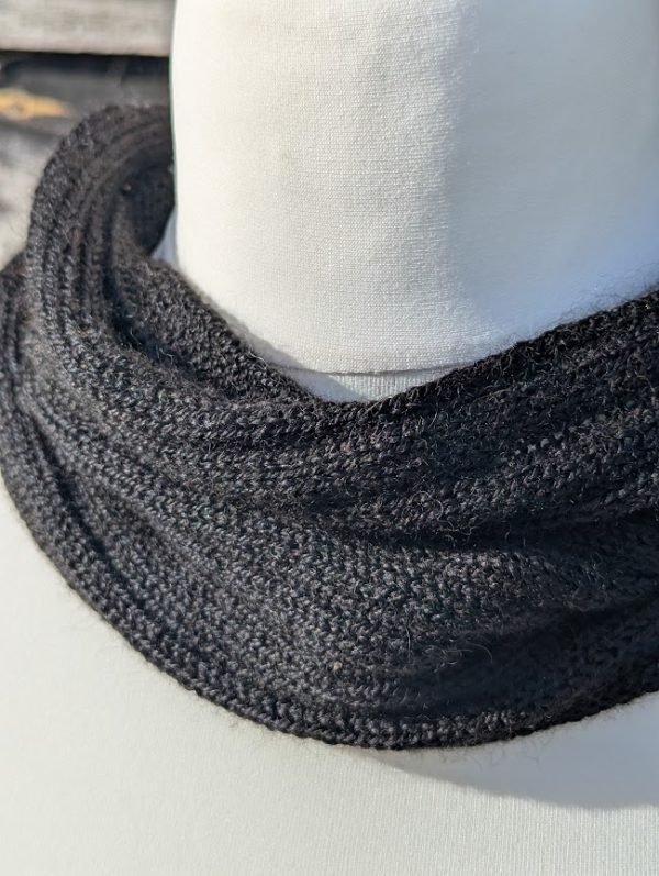 close up of black alpaca snood on display dummy