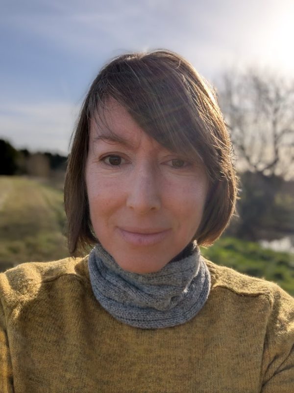 lady wearing shetland wool snood in mid grey