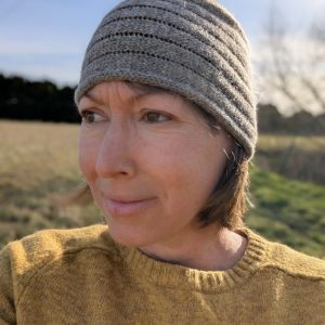 lady wearing mid grey shetland wool headband