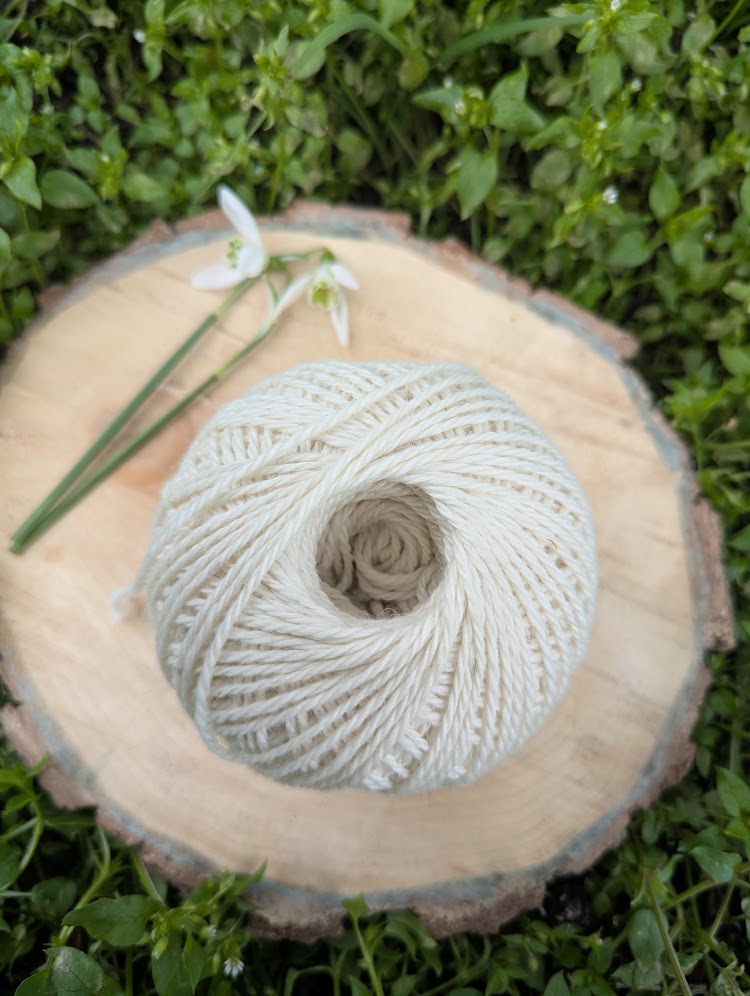 50g ball of white alpaca yarn