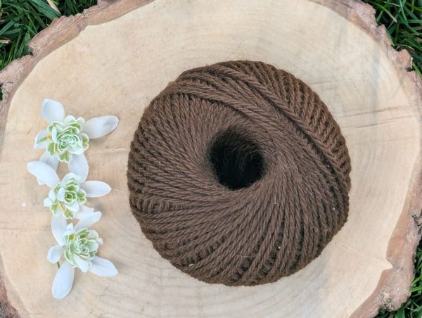 50g ball alpaca yarn in a dark clay loam colour