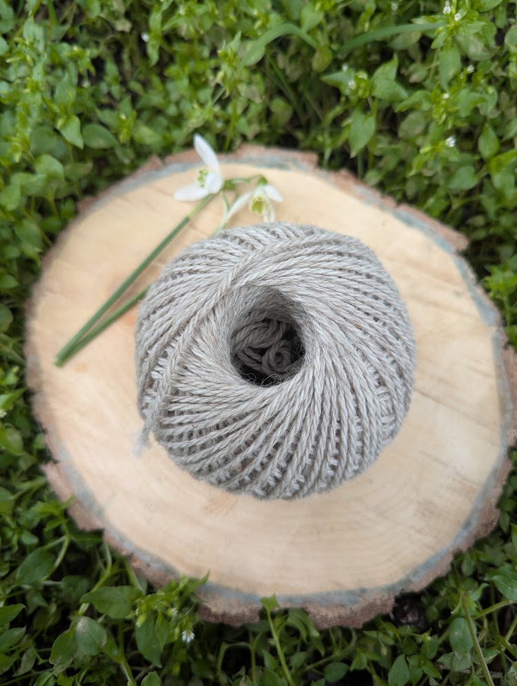 light drey alpaca yarn in a 50g ball