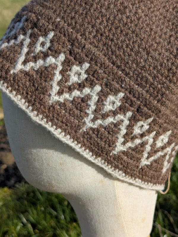 close up detail of shetland wool hat in brown and white tapestry crochet