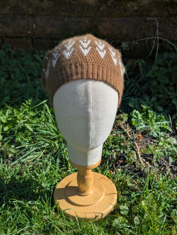 front view of slouchy alpaca beanie in brown and white