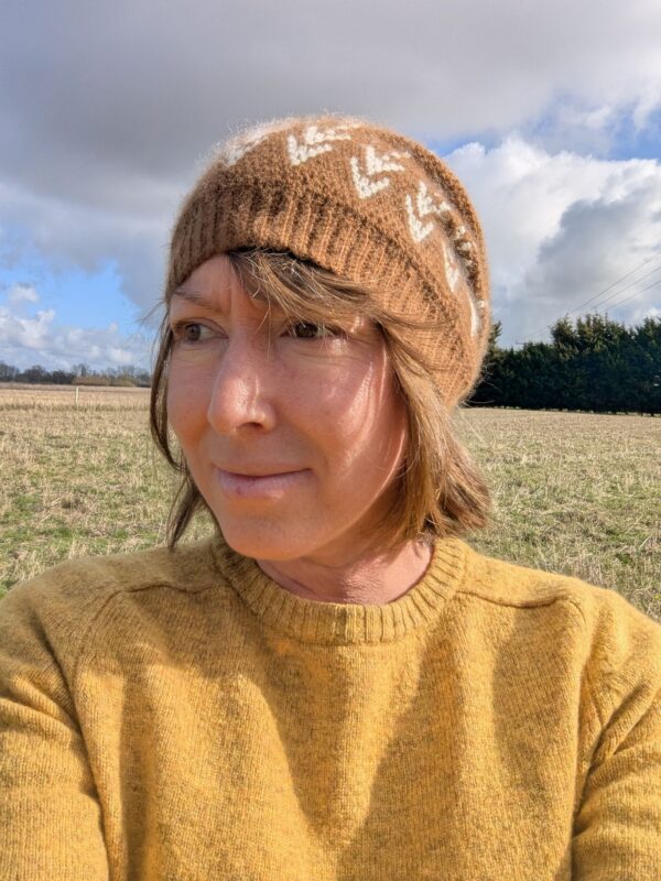 brown and white slouchy beanie with an ears of barley design