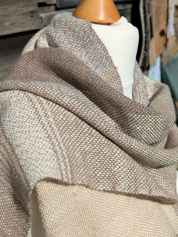 close up of woven alpaca scarf in soft neutral colours