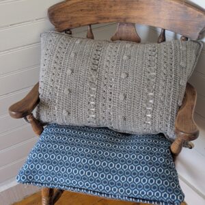 grey shetland wool crochet cushion on chair