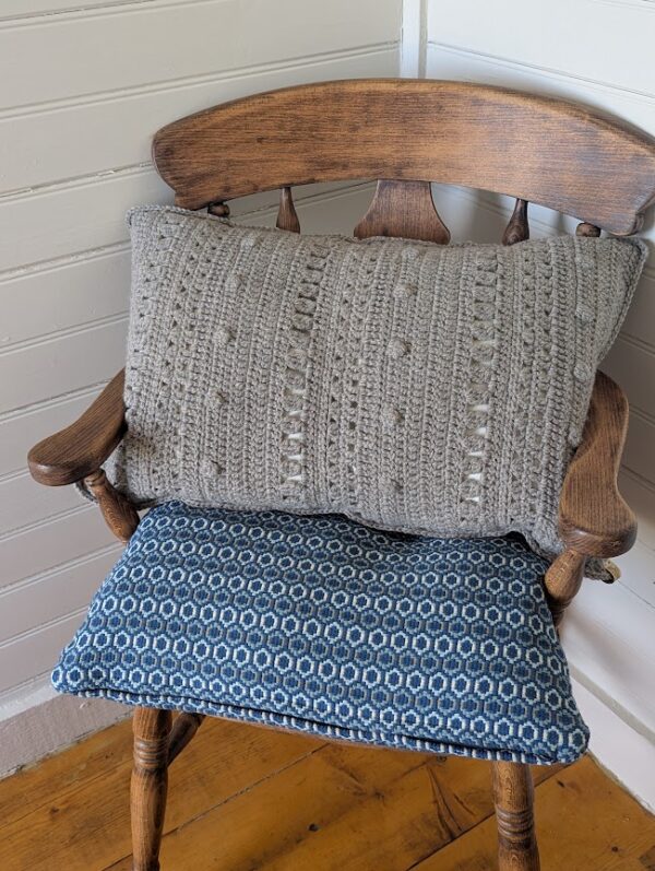 grey shetland wool crochet cushion on chair