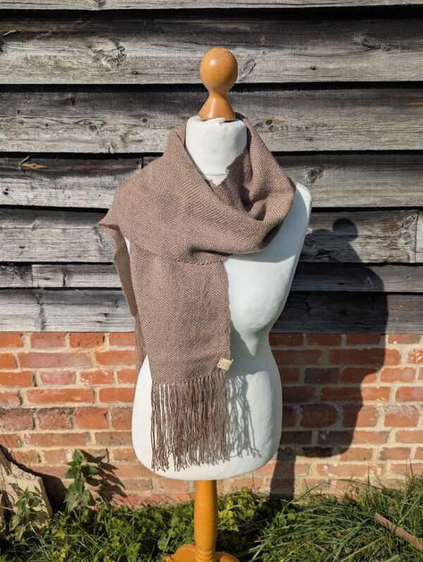 woven alpaca scarf in dormouse brown wrapped around a dress dummy