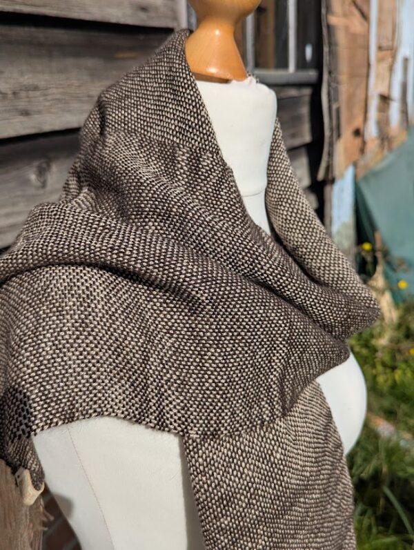 side view of woven alpaca scarf in dark brown and cream