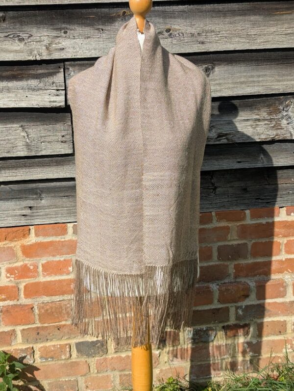 suri alpaca scarf in soft cream and brown loose on dress dummy