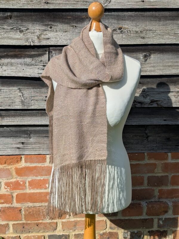 suri alpaca scarf in cream and brown wrapped around dress dummy