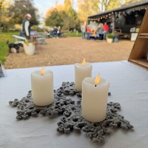 snowflake coasters with candles at a market