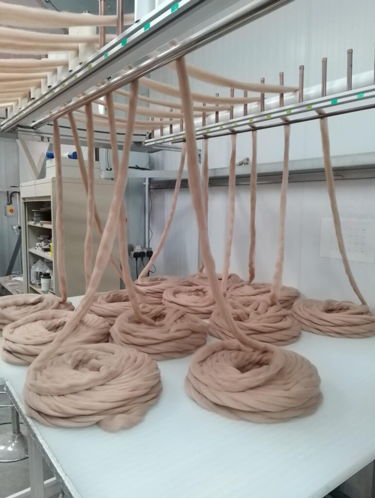 alpaca fibre going into the spinner