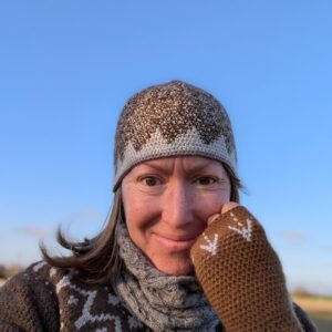 brown alpaca wrist warmers with light grey barley pattern