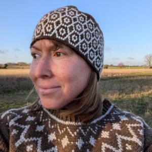 brown shetland wool hat with white alpaca yarn hive pattern